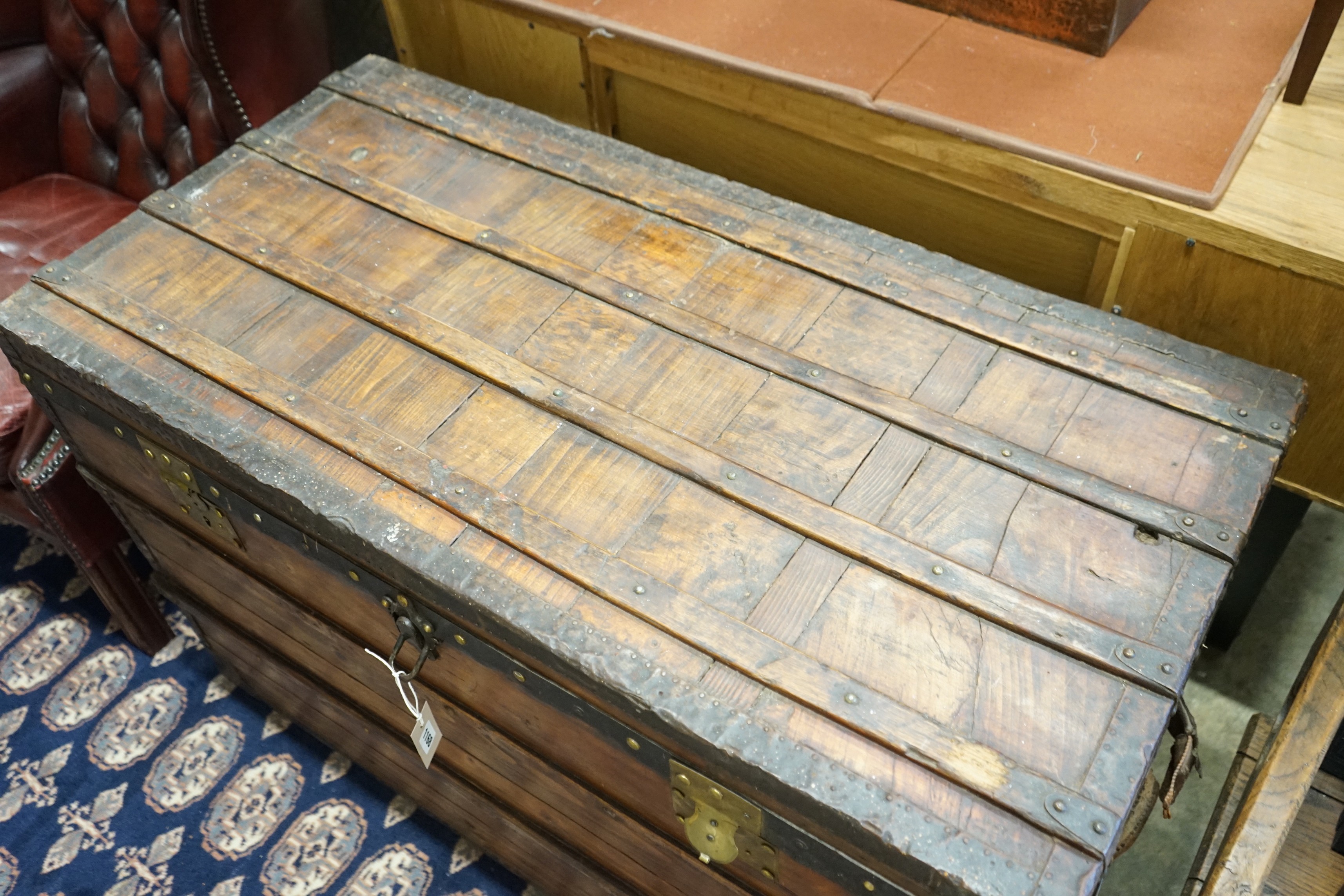 A Victorian iron and brass mounted trunk, length 109cm, depth 54cm, height 70cm